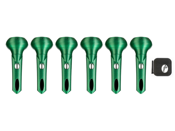 Six green, metal Sensor add-ons arranged in a row, with a small black and white item next to them on the right.